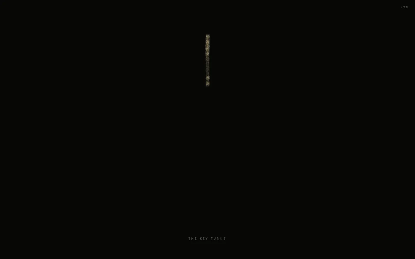 The key turned edge on, a thin line of gold
